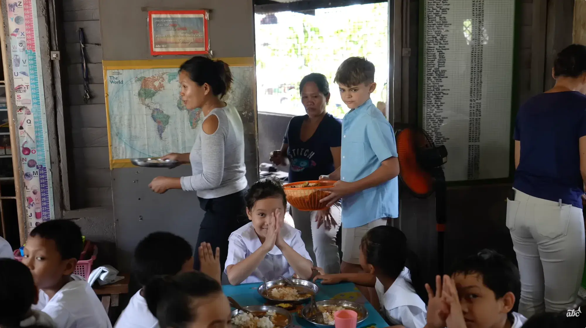 Colt Lockwood serves lunch to schoolchildren at the Atmosphere soup kitchen in Dauin