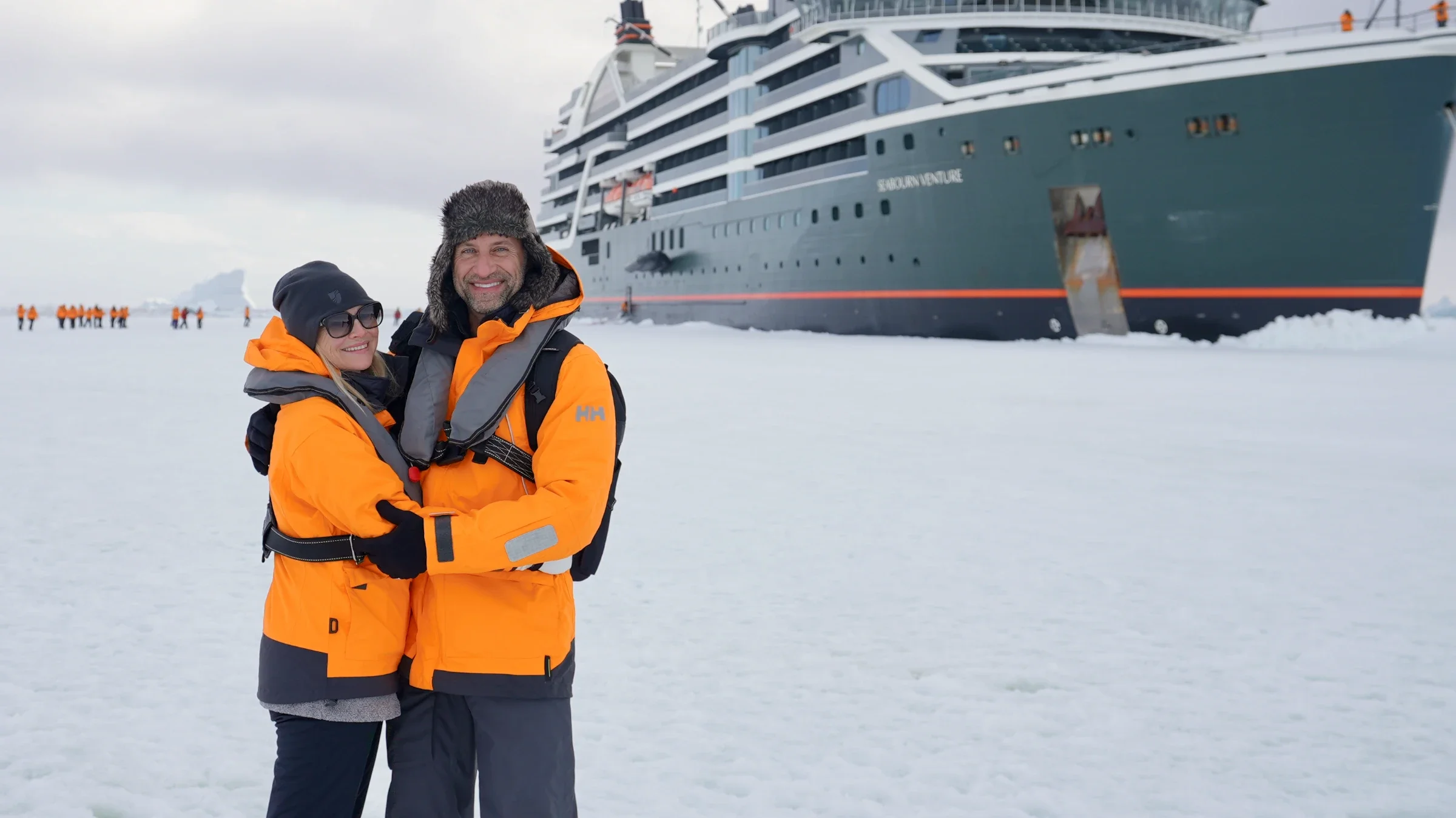 Phil and Erin on the Antarctic sea ice, Seabourn Venture behind them