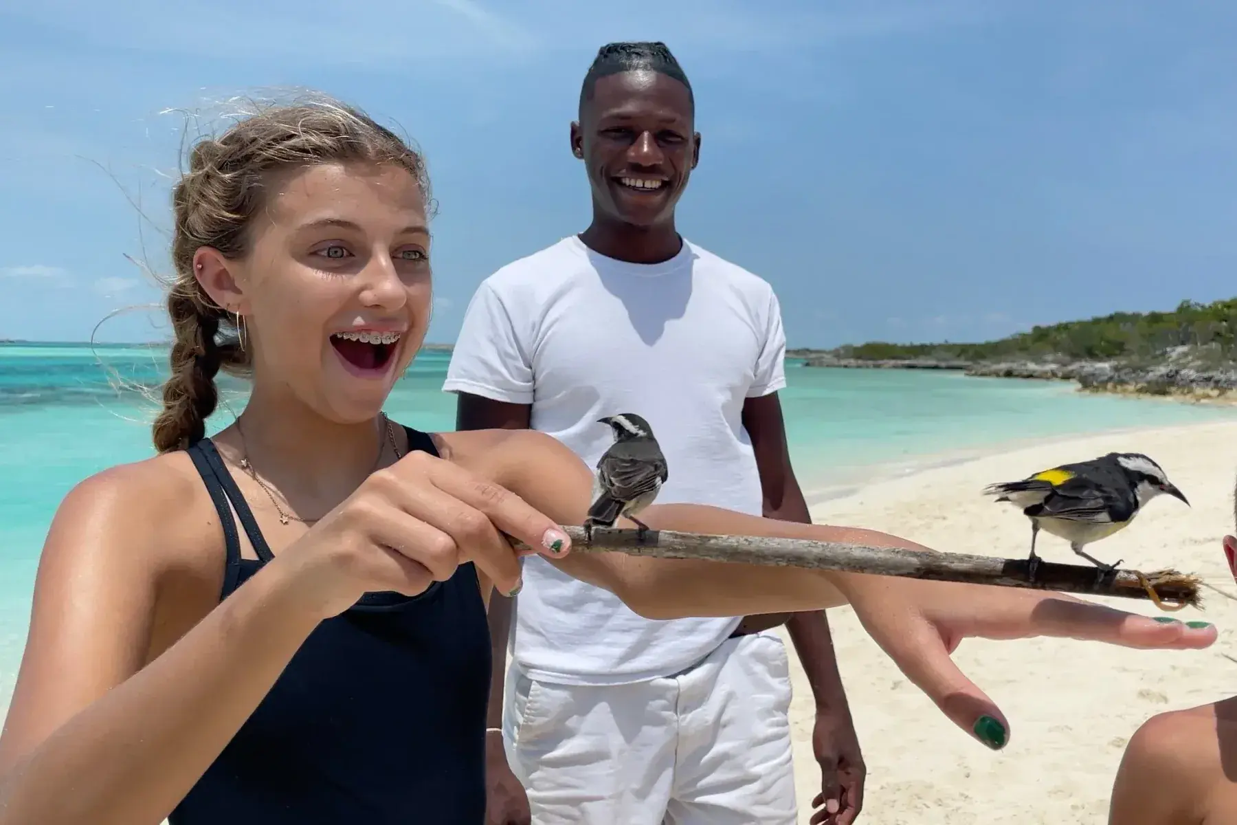 Reagan with a bird in the Bahamas