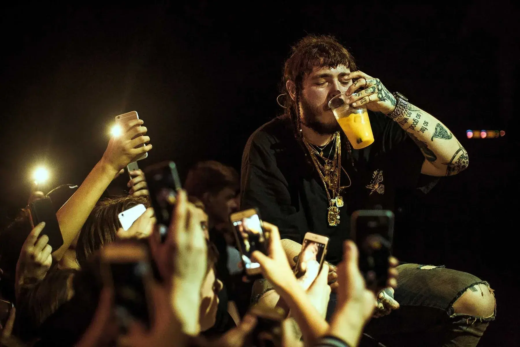 Post Malone on stage with front-row fans