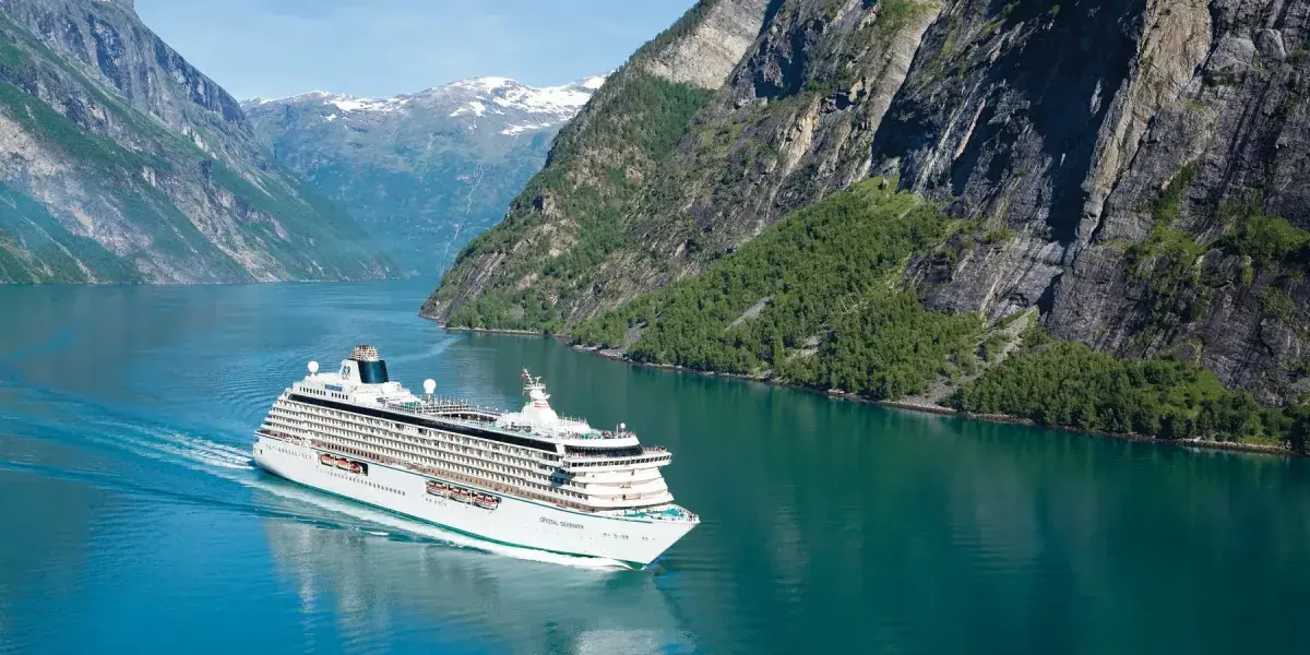 Crystal Serenity cruise ship sails through a fjord