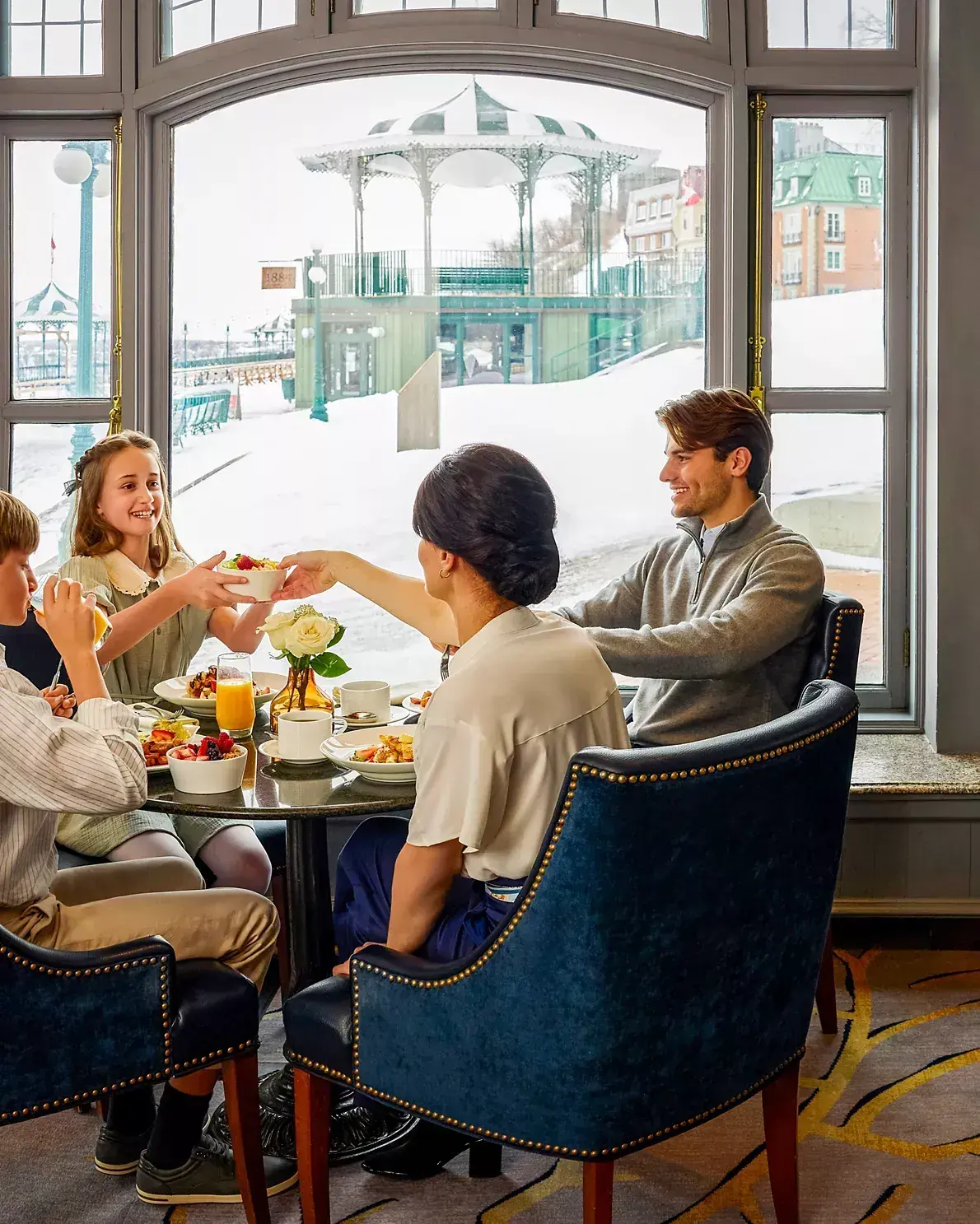 A family dines at the Fairmont Le Château Frontenac