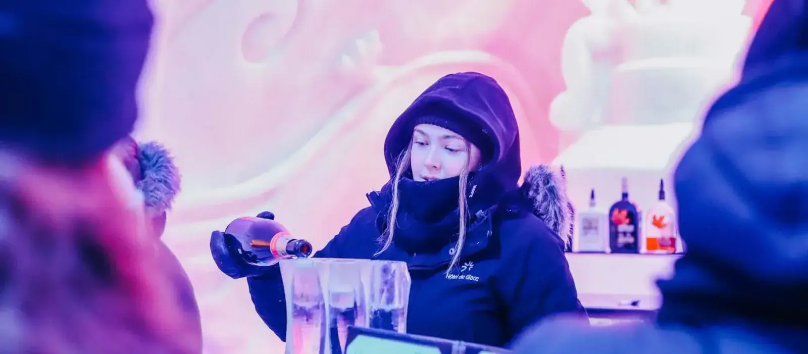 A bartender pours champagne at the Hotel de Glace in Quebec City