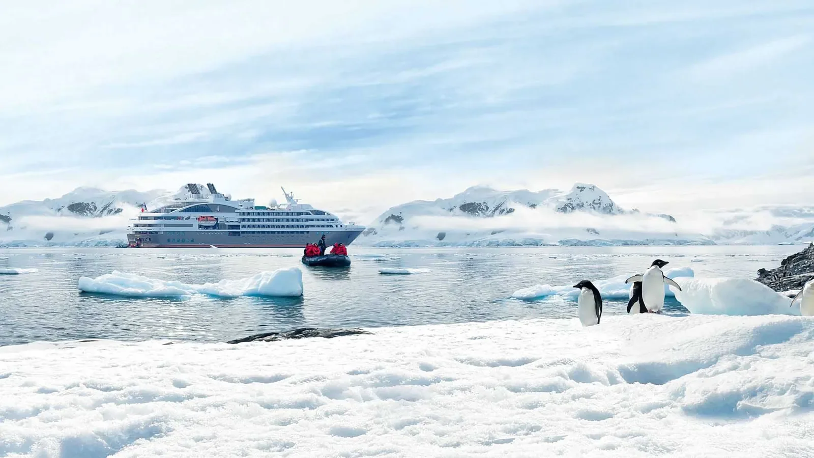 Ponant Explorer-class Zodiac landing with penguins in Antarctica