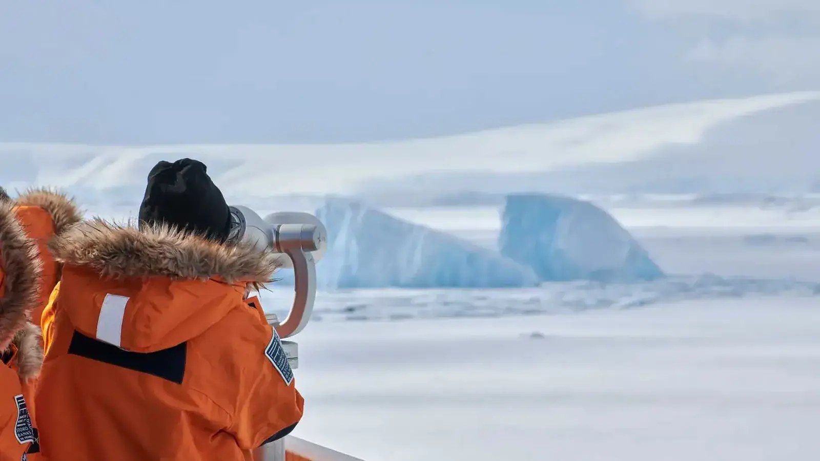 Passengers spotting icebergs from Le Commandant Charcot