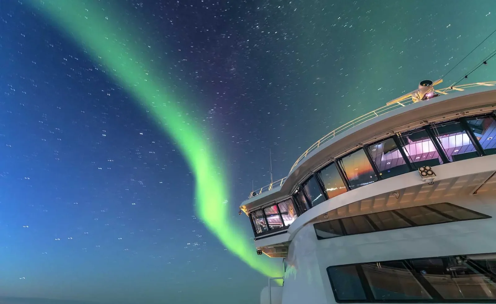 HX expeditions ms roald amundsen bridge with northern lights