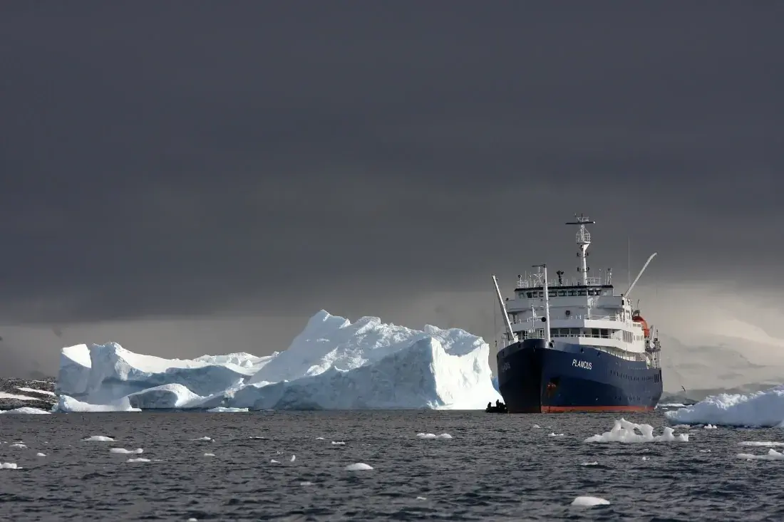 MV Plancius among Antarctic icebergs