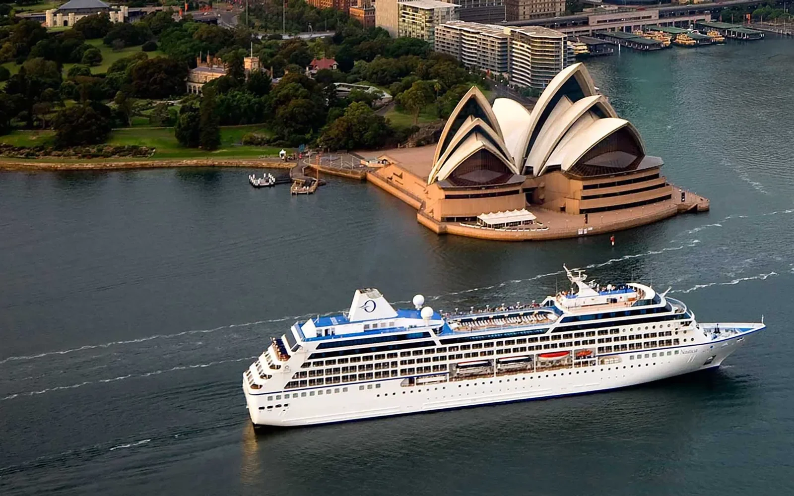 Oceania Insignia cruise ship sailing past Sydney Opera House