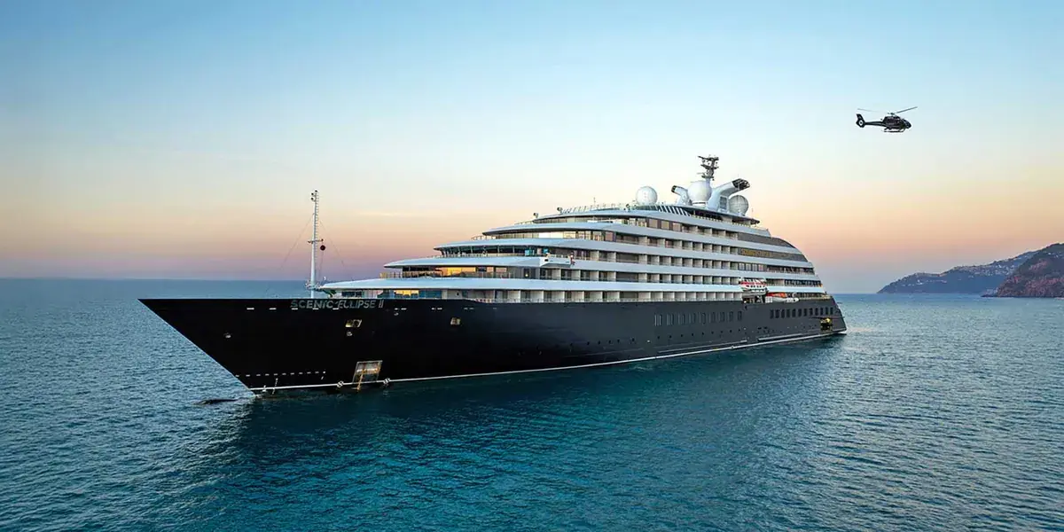 Scenic Eclipse II with helicopter at dusk