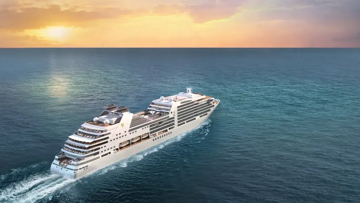 Aerial view of the Seabourn Encore cruise ship sailing into the sunset