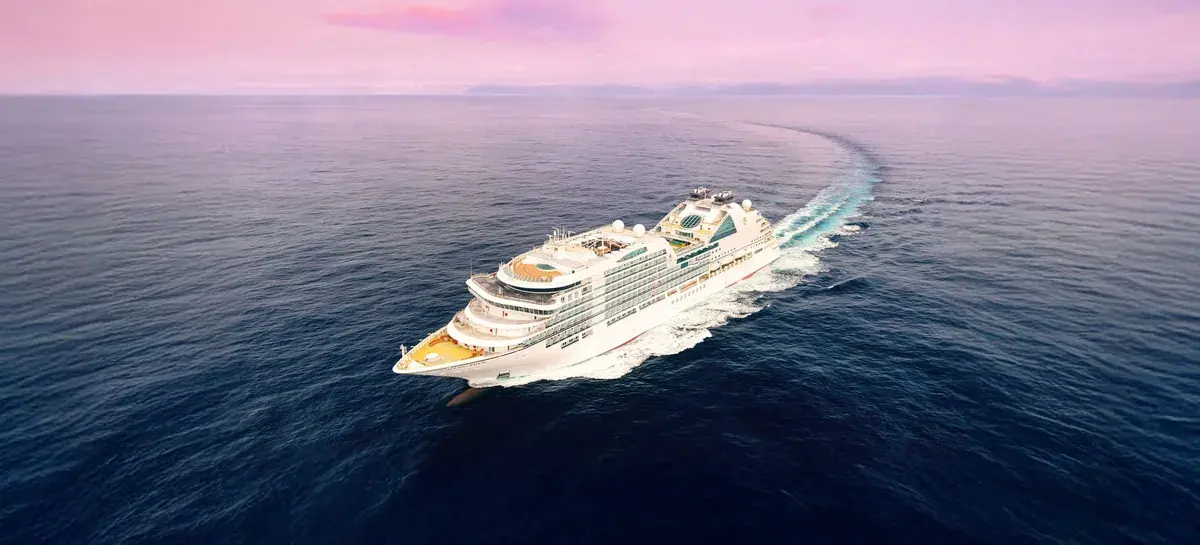 Aerial view of the Seabourn Ovation cruise ship sailing into the sunset