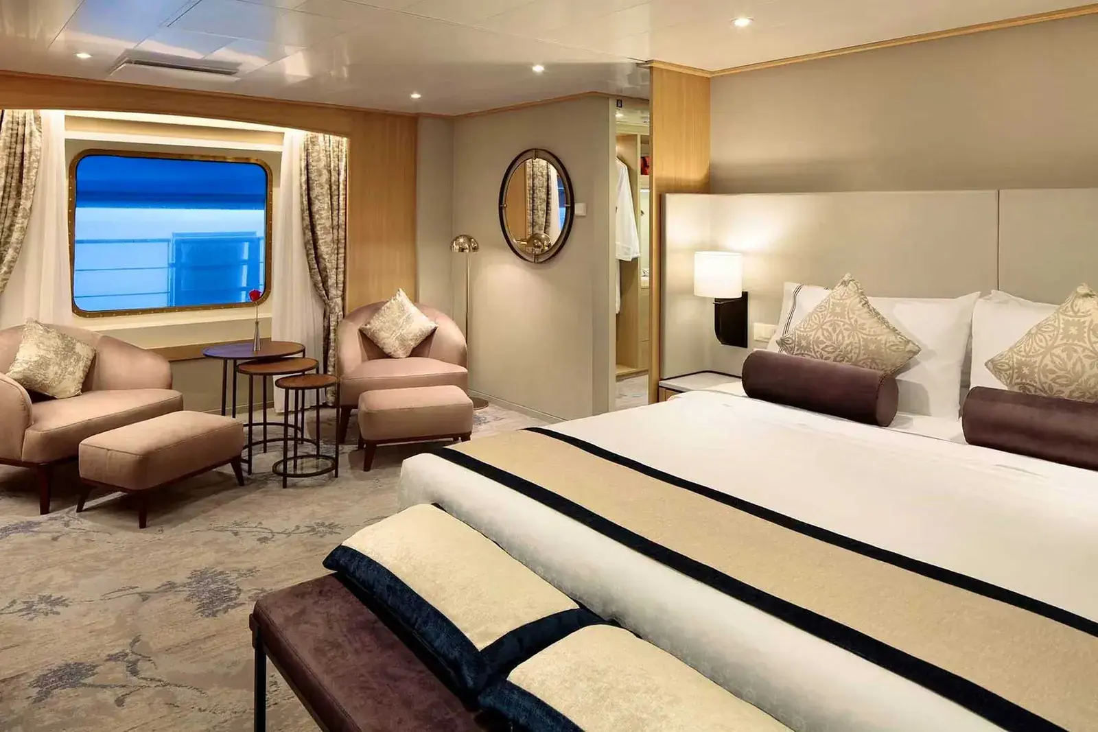 Luxurious suite interior aboard Windstar Star Breeze with warm lighting and elegant decor