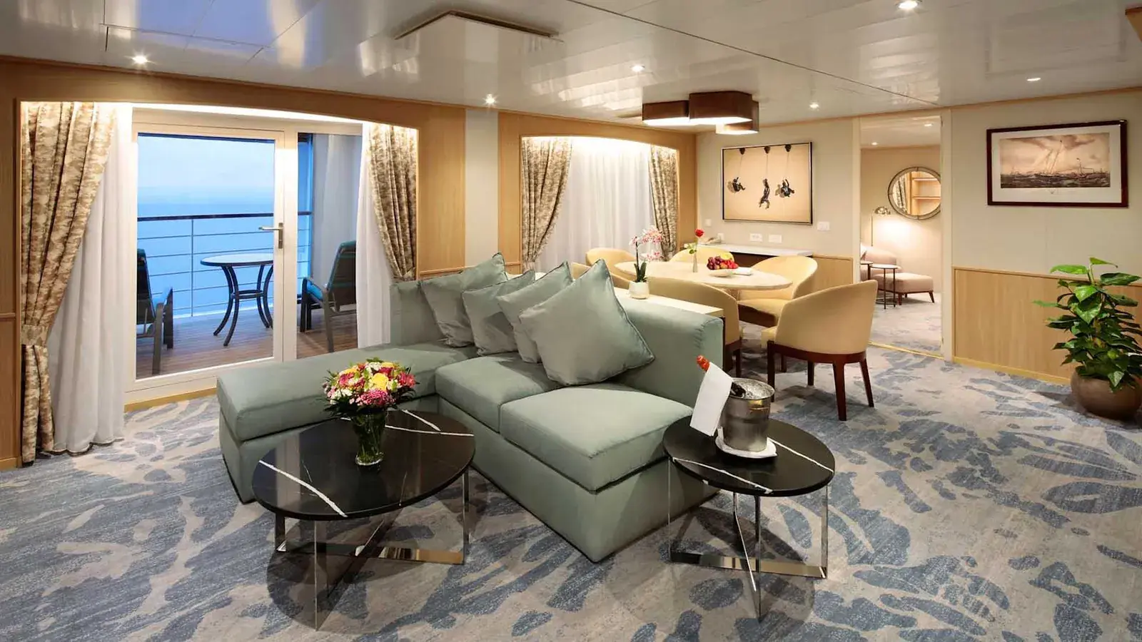 Suite living room aboard Windstar Star Breeze with ocean-facing seating