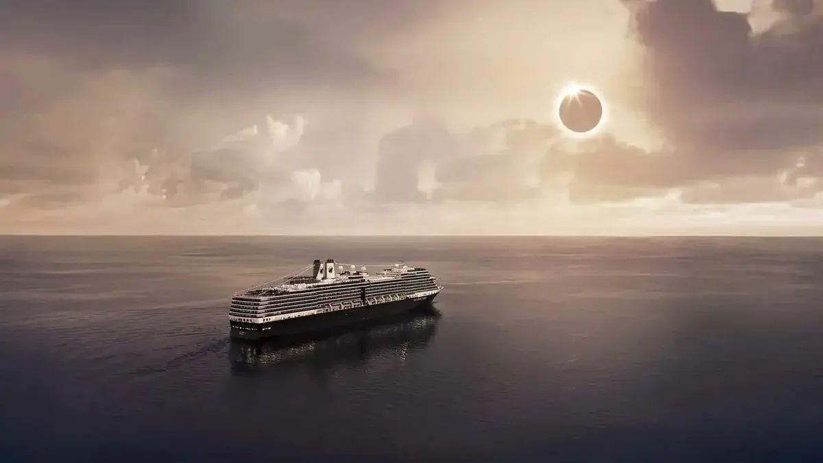 A Holland America cruise ship sails towards a total solar eclipse