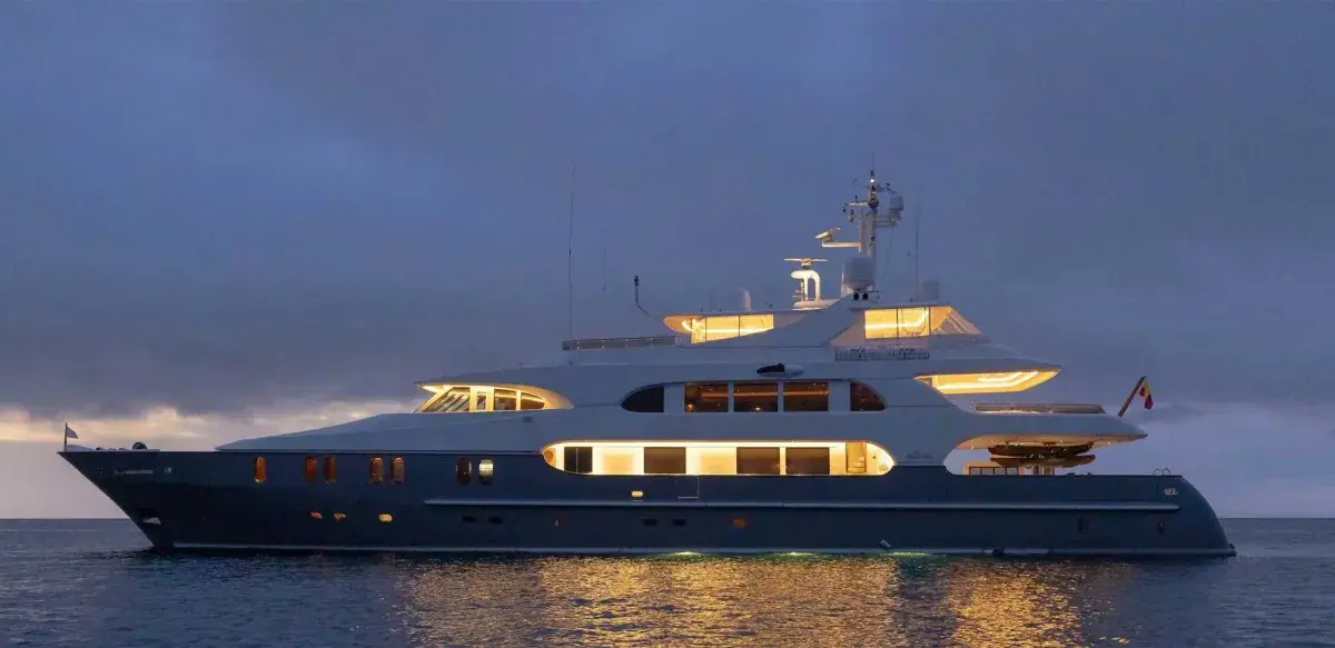A Galapagos yacht sits at anchor at dusk