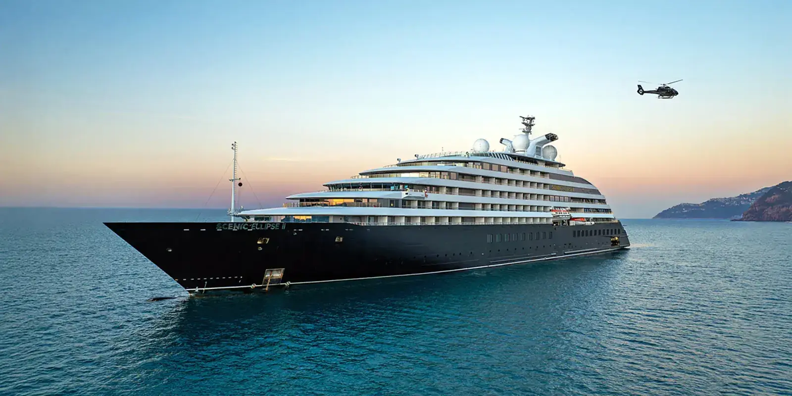 A helicopter flies from the deck of the Scenic Eclipse II yacht