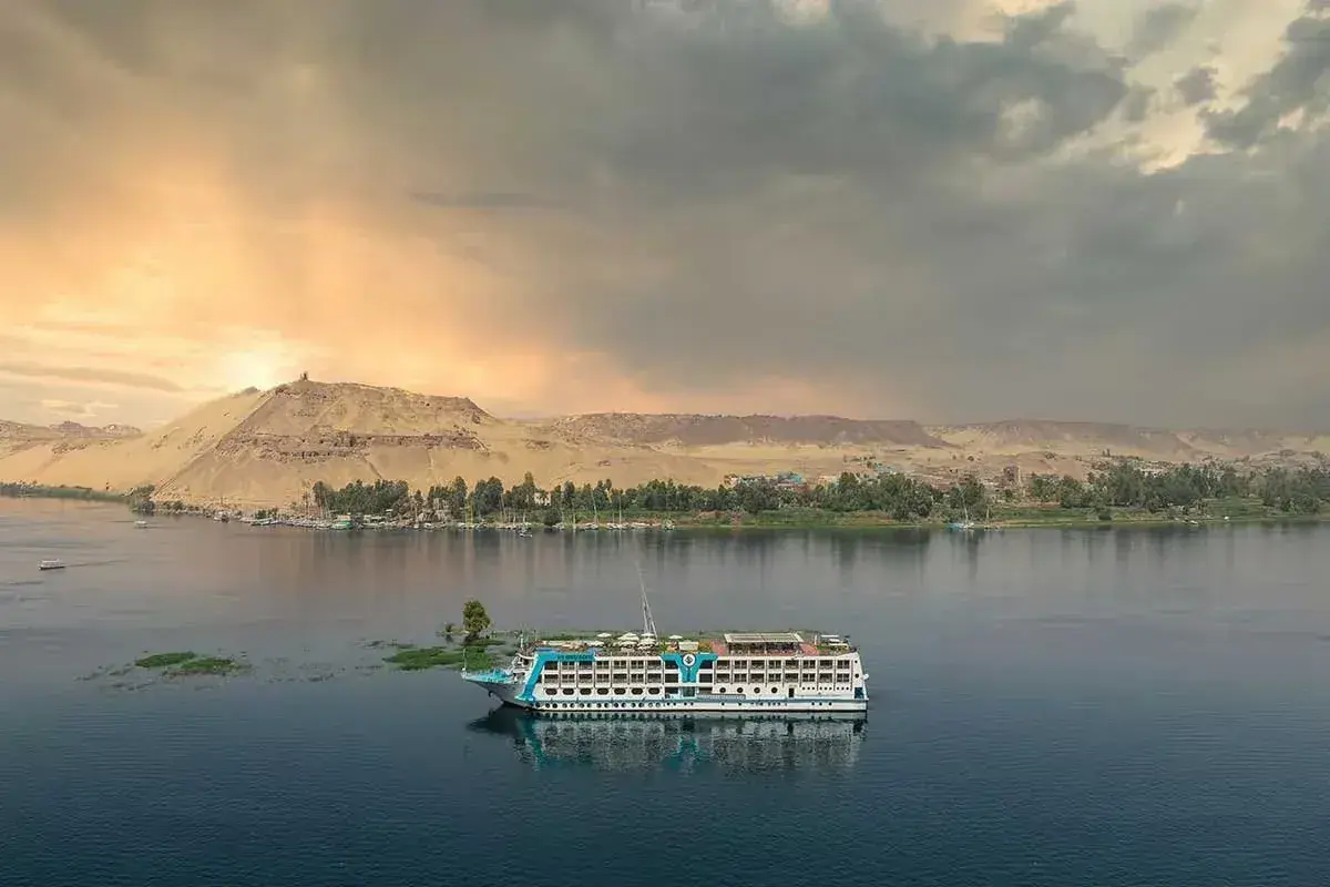 A cruise ship sails down the Nile river