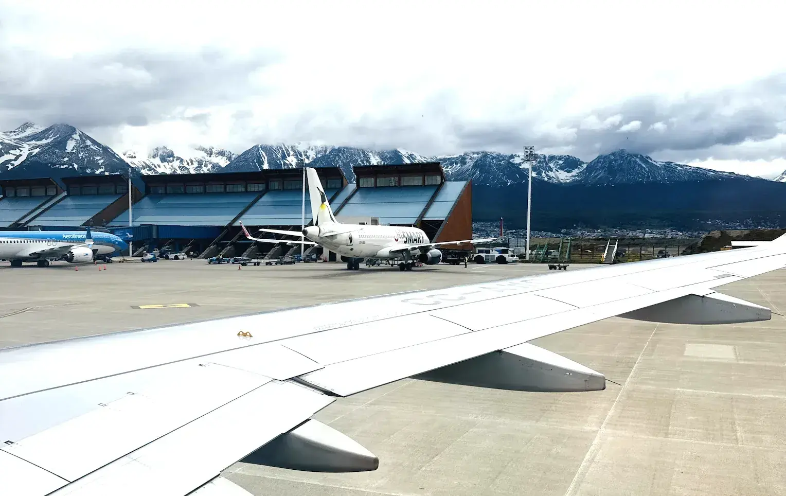 View from an airplane window on the tarmac of Ushuaia airport