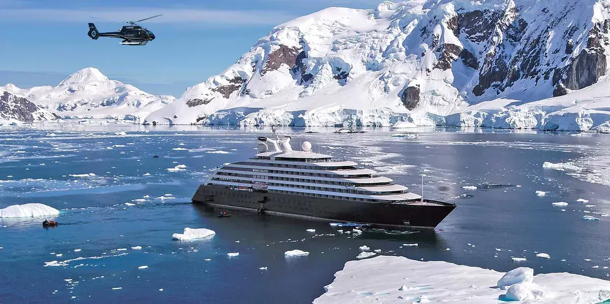 Scenic Eclipse in Antarctica with a helicopter on the aft deck
