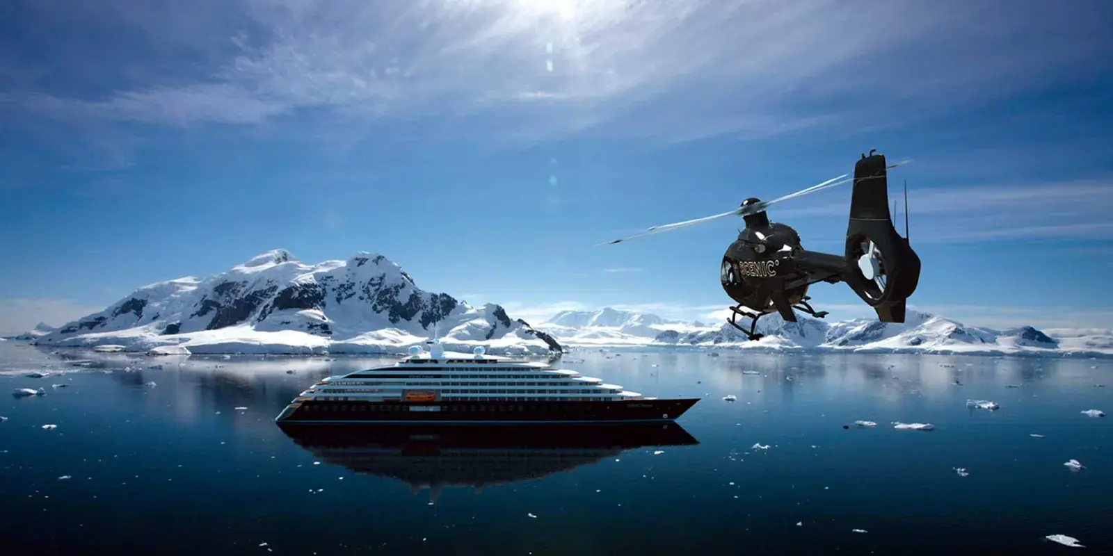 A helicopter approaches the Scenic Eclipse yacht in Antarctica