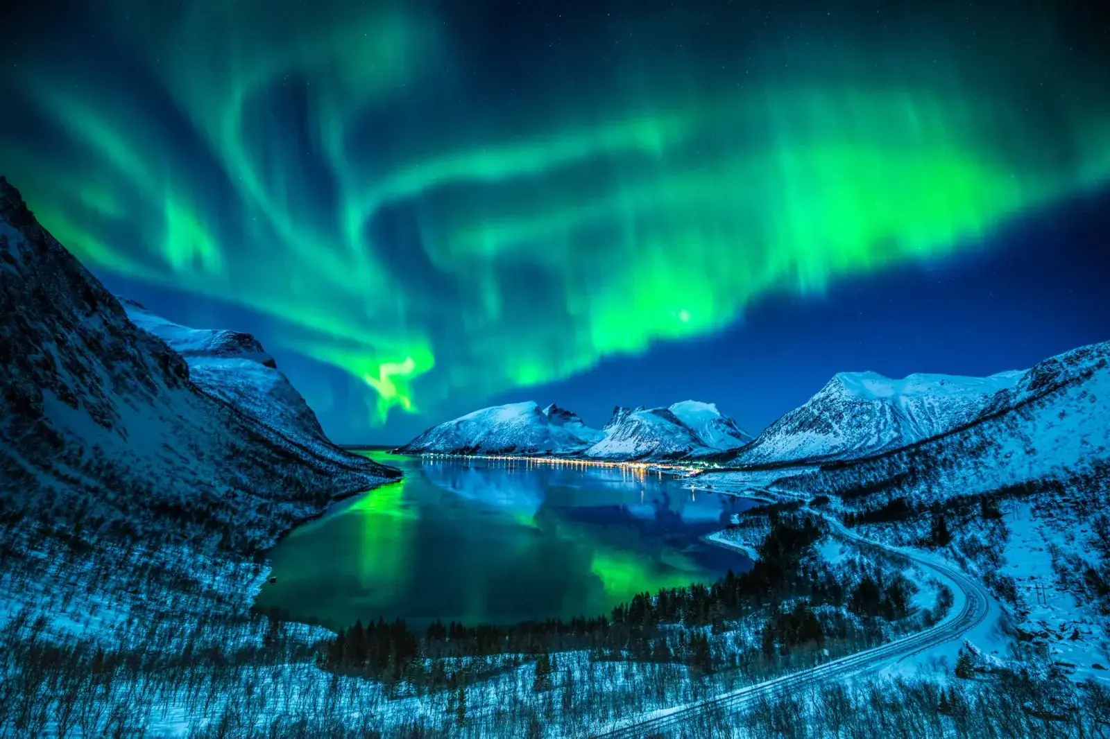 Nighttime Norther Lights over a Norwegian fjord