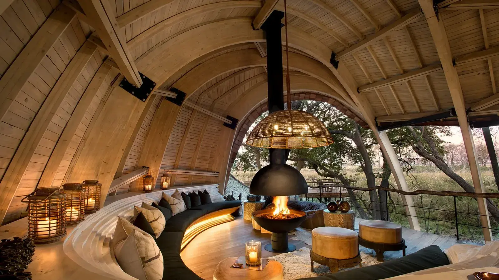 An indoor/outdoor hut with fireplace