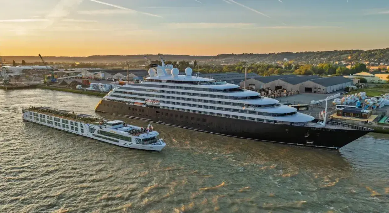 A Scenic yacht next to a Scenic river cruise ship