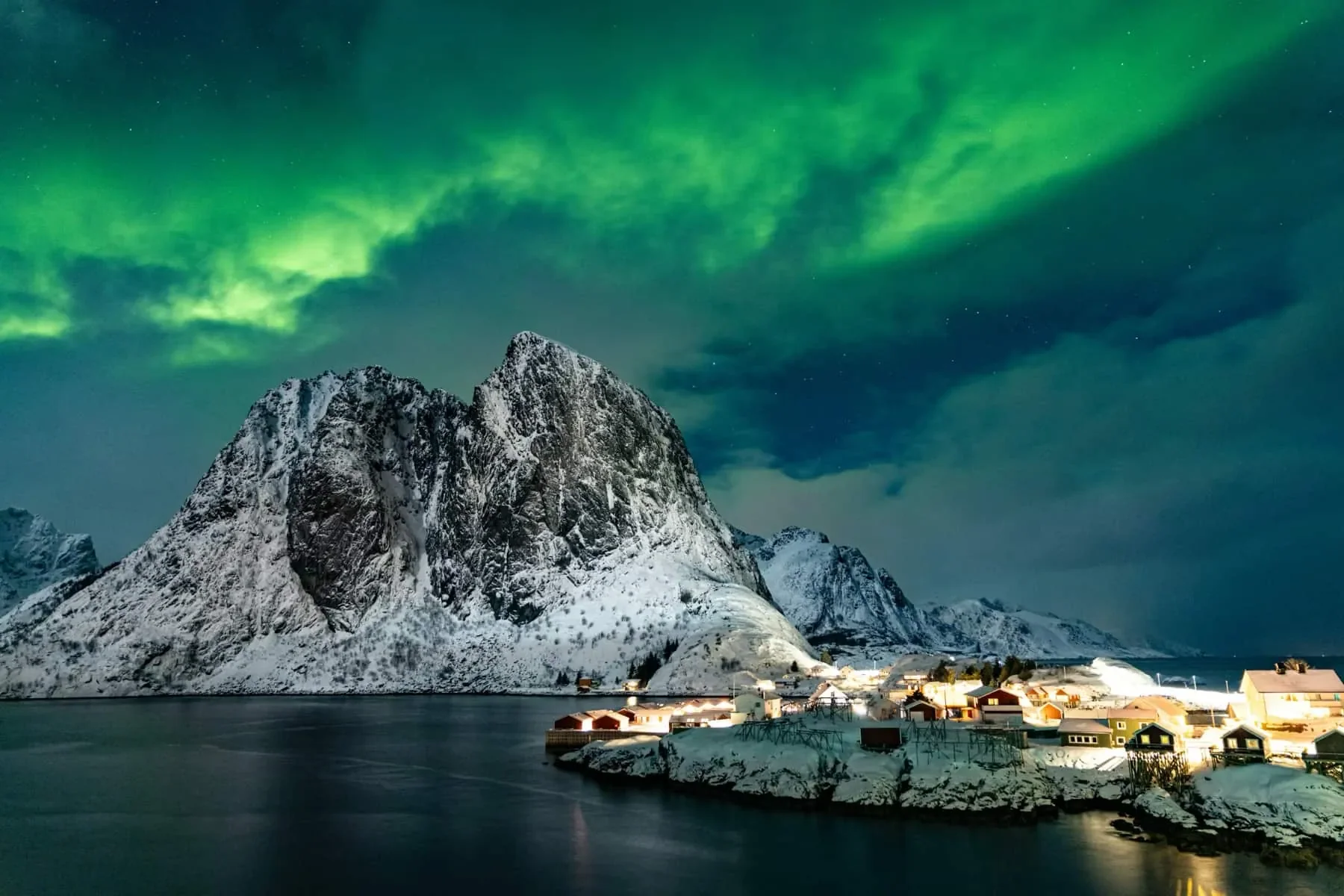 The Norther Lights above Arctic mountains