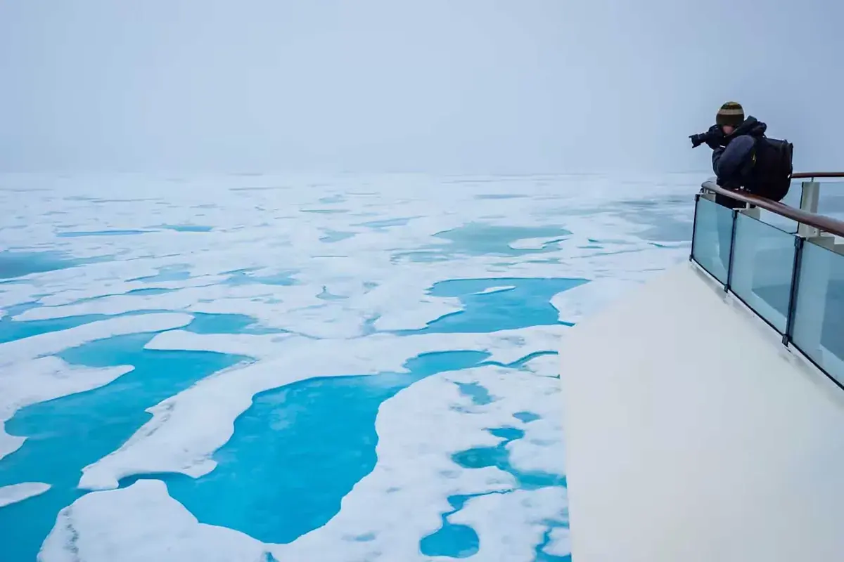 National Geographic photographer shooting from ship deck in Antarctica