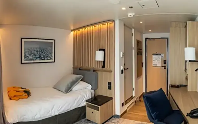 Quark Ultramarine Solo Panorama cabin with floor-to-ceiling windows designed for single travelers