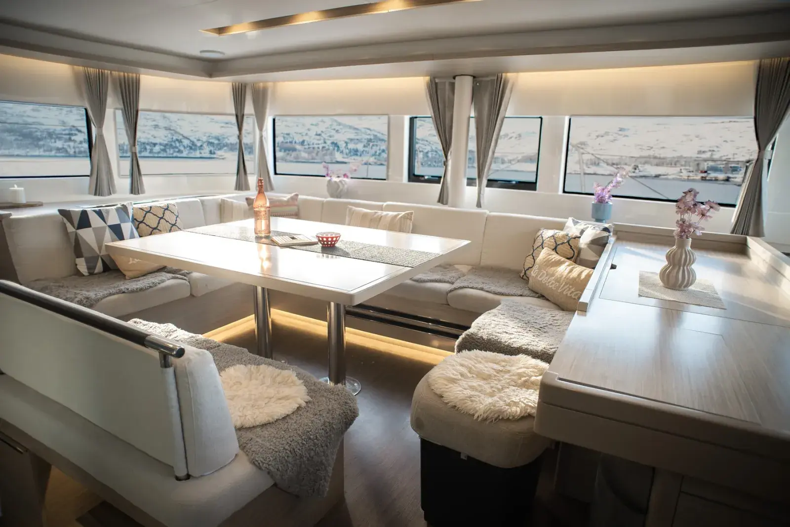 Interior saloon and lounge aboard the Arctic Dream expedition catamaran
