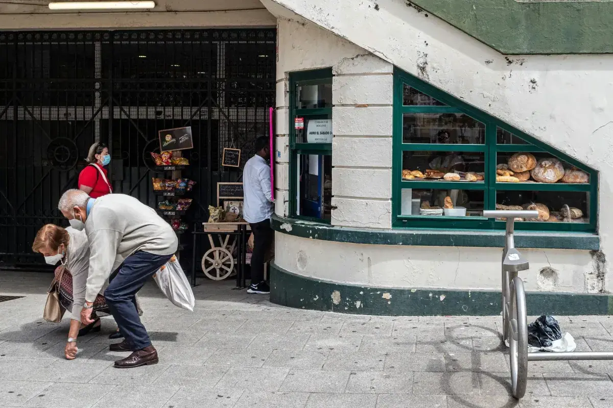 Locals on a sidewalk in La Coruna