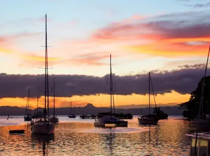 Sailboats at sunset in Fiji