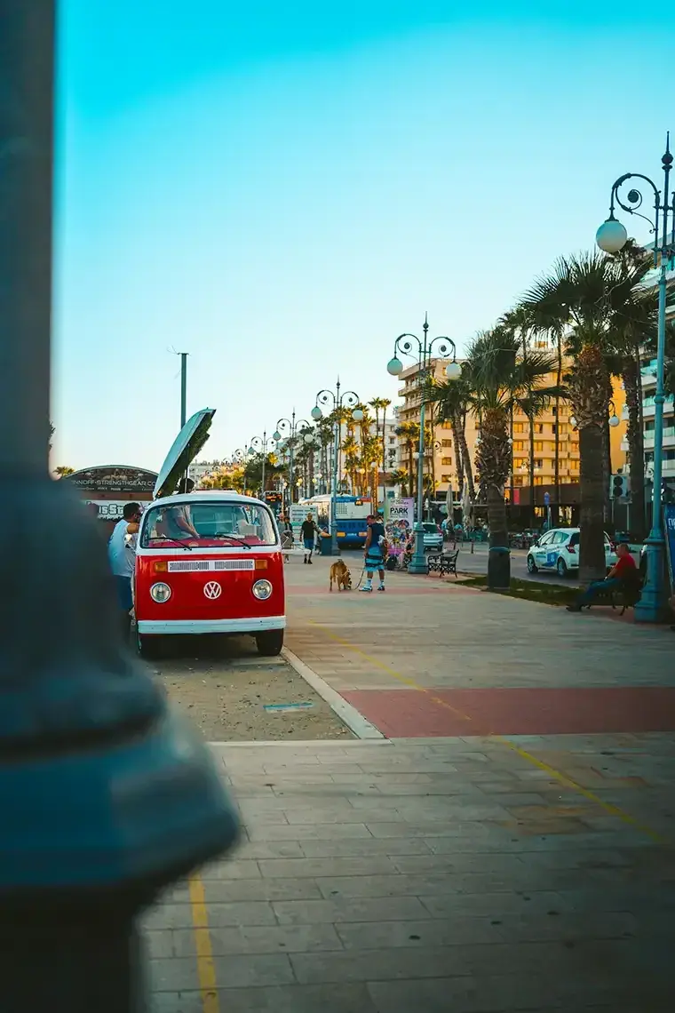 A red bus sits on a local street in Larnaca, Cyprus