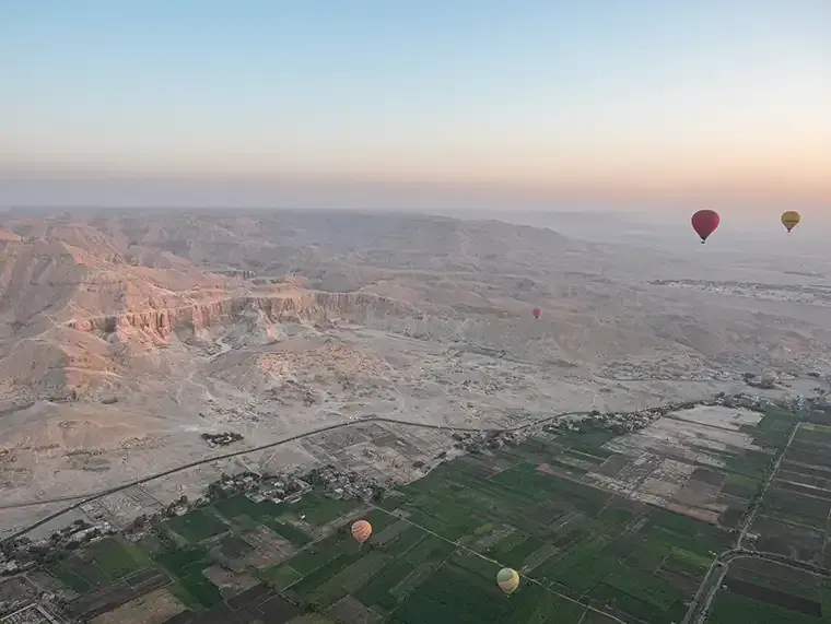 Hot air balloons sail over Valley of the Kings in Egypt