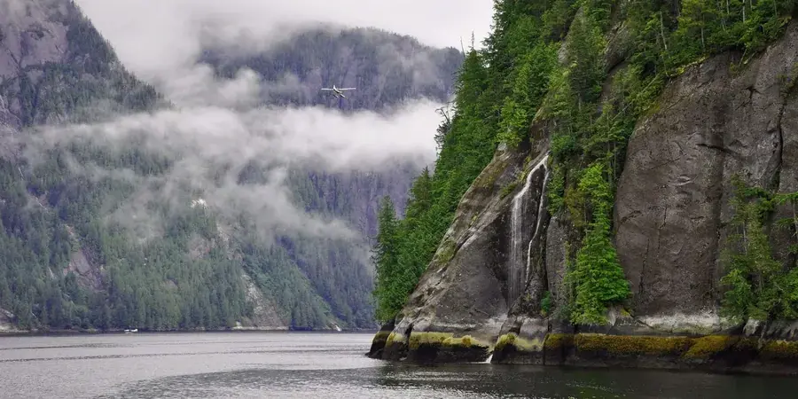 Towering cliffs and waterfalls in Misty Fjords, Alaska