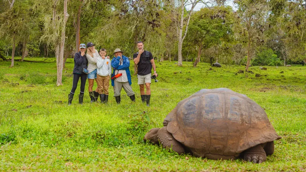 The Lockwood family poses next to a giant tortoise on the Galapagos Islands