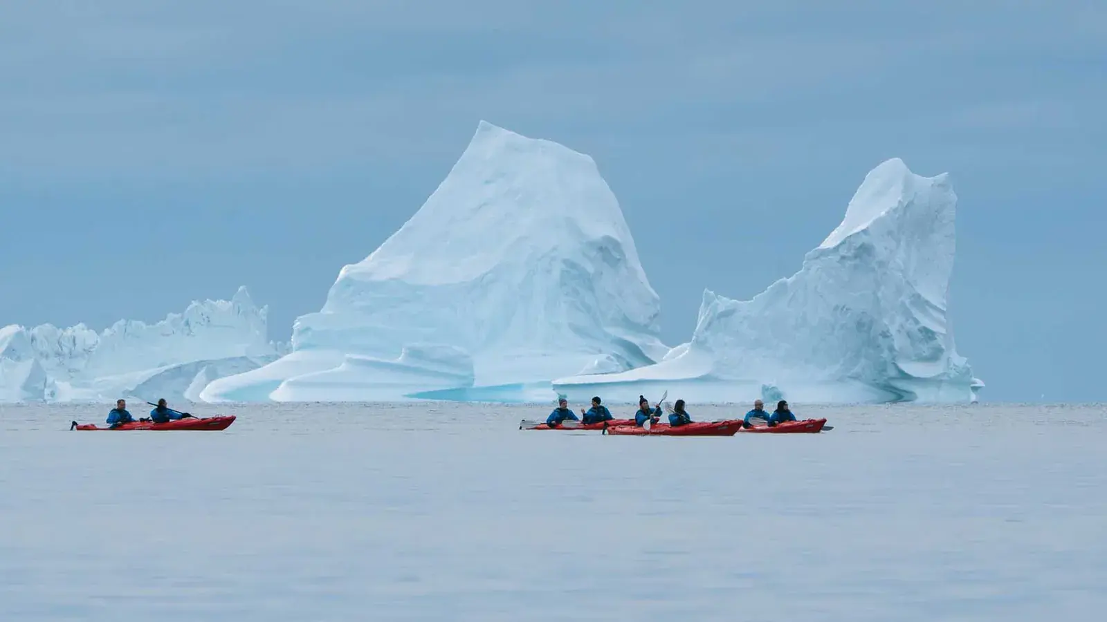 Kayakers among towering Greenland icebergs
