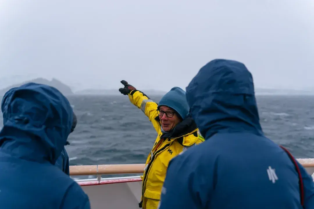 A guide instructs explorers off Half Moon Island