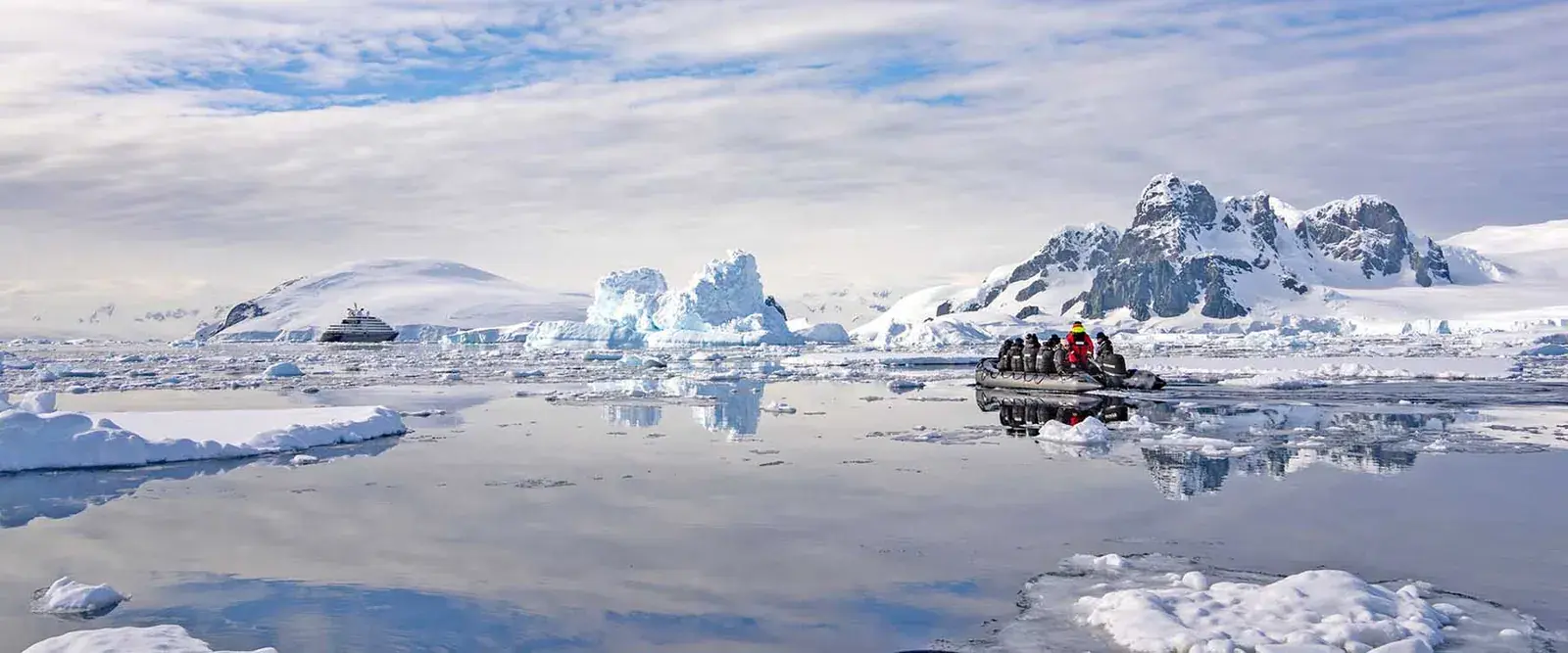 Scenic Eclipse Zodiac cruising through a channel of floating icebergs in Antarctica
