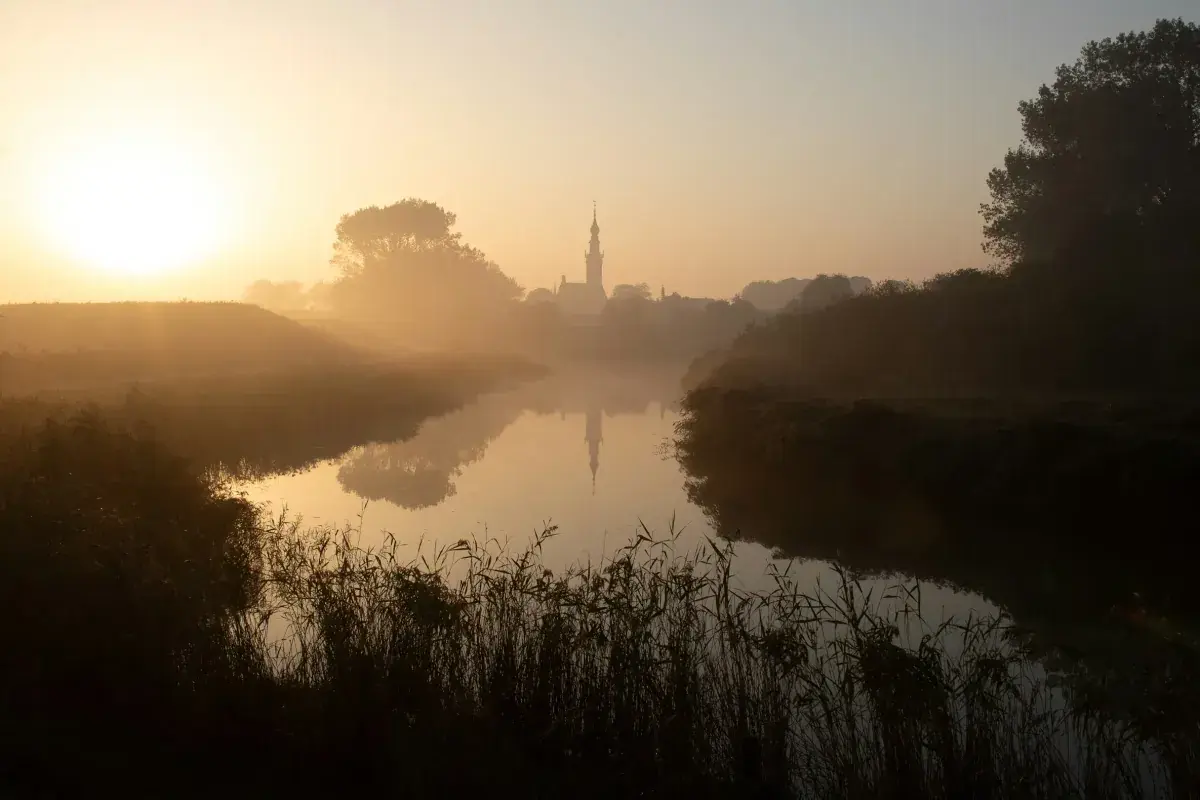 Sunrise over a canal in Veere, Netherlands