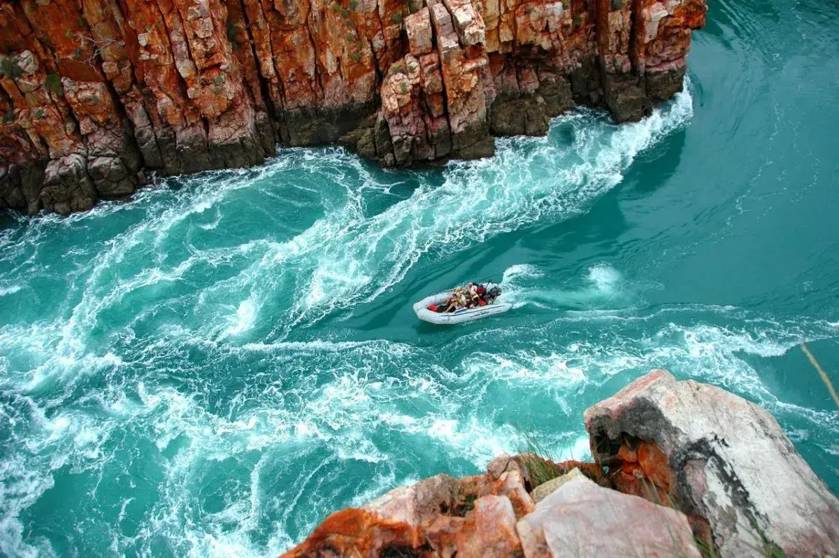 A zodiac sails through Talbot Bay in the Kimberley, Australia