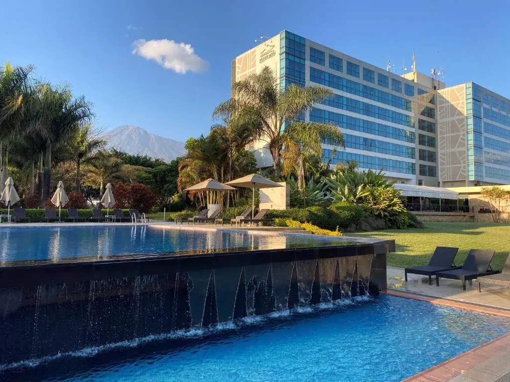 Mount Meru Hotel with Kilimanjaro in the distance