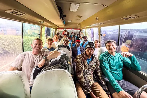 Hikers on a bus to Kilimanjaro