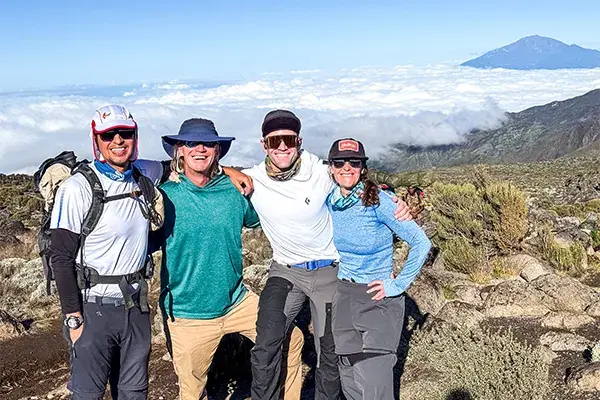 Hikers pose on Kilimanjaro