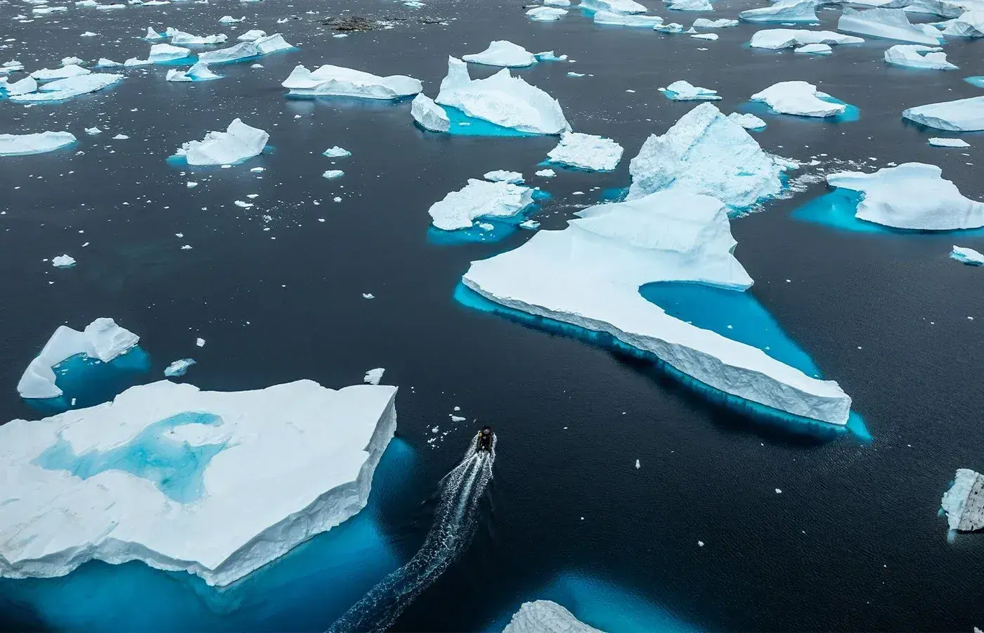 A zodiac dodges an iceberg field in Antarctica