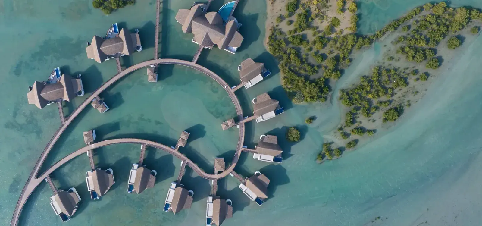 Aerial view of overwater villas at Mina Al Arab in the UAE
