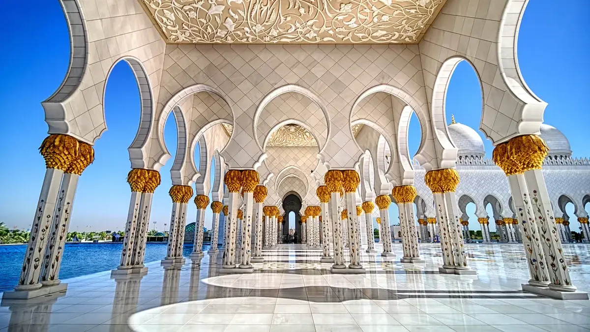 The gold-capped colonnade of the Sheikh Zayed Grand Mosque in Abu Dhabi