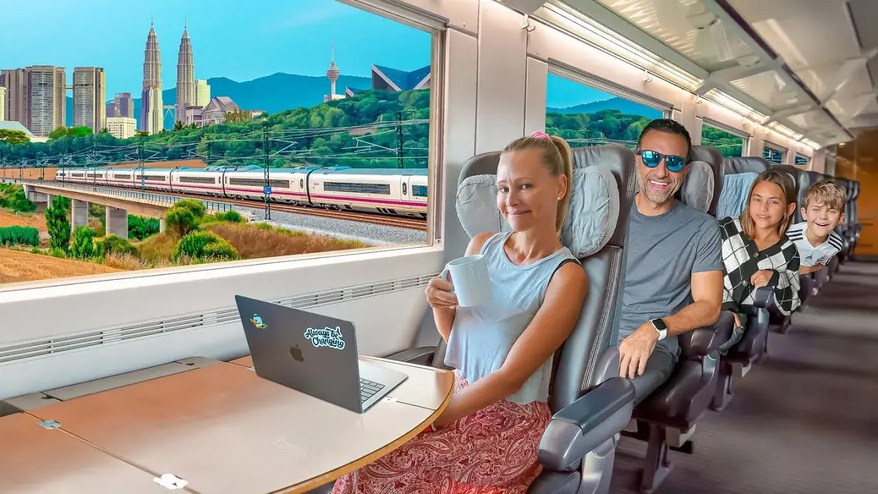 The Lockwood family riding a train through Malaysia
