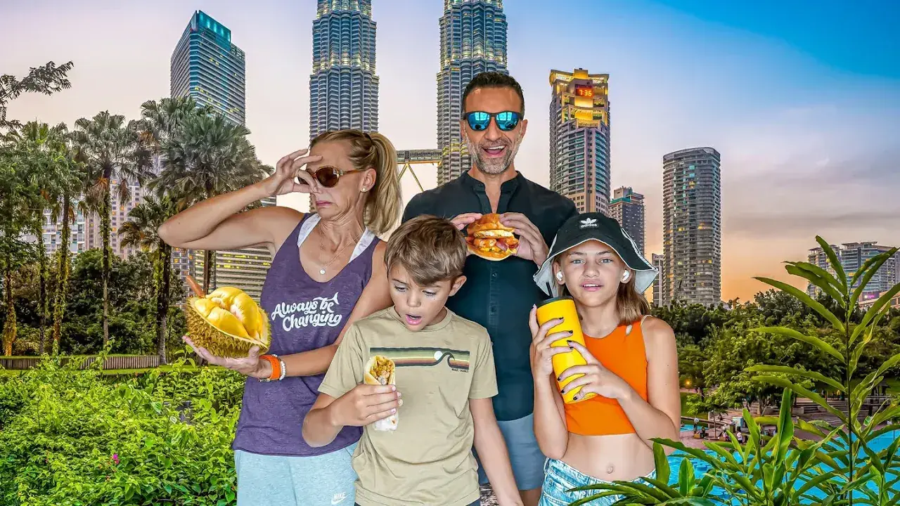 The Lockwood family poses in front of Kuala Lumpur skyline